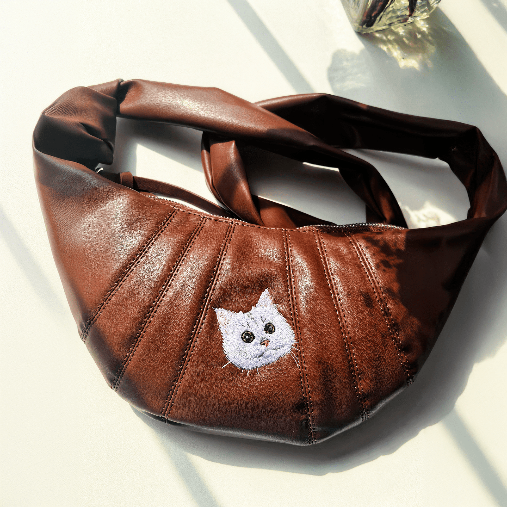 custom cat embroidered croissant bag in brown with hand-drawn portrait